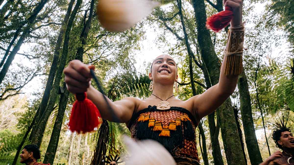 Photo of women performing poi in the forest