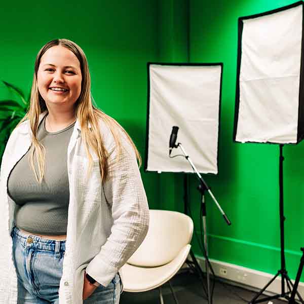 Photo of student in Te Whare Wānanga o Awanuiārangi podcasting studio