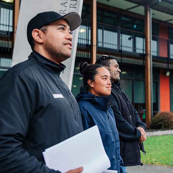 Three people standing