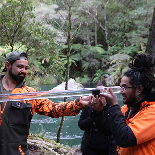 Two people doing water testing