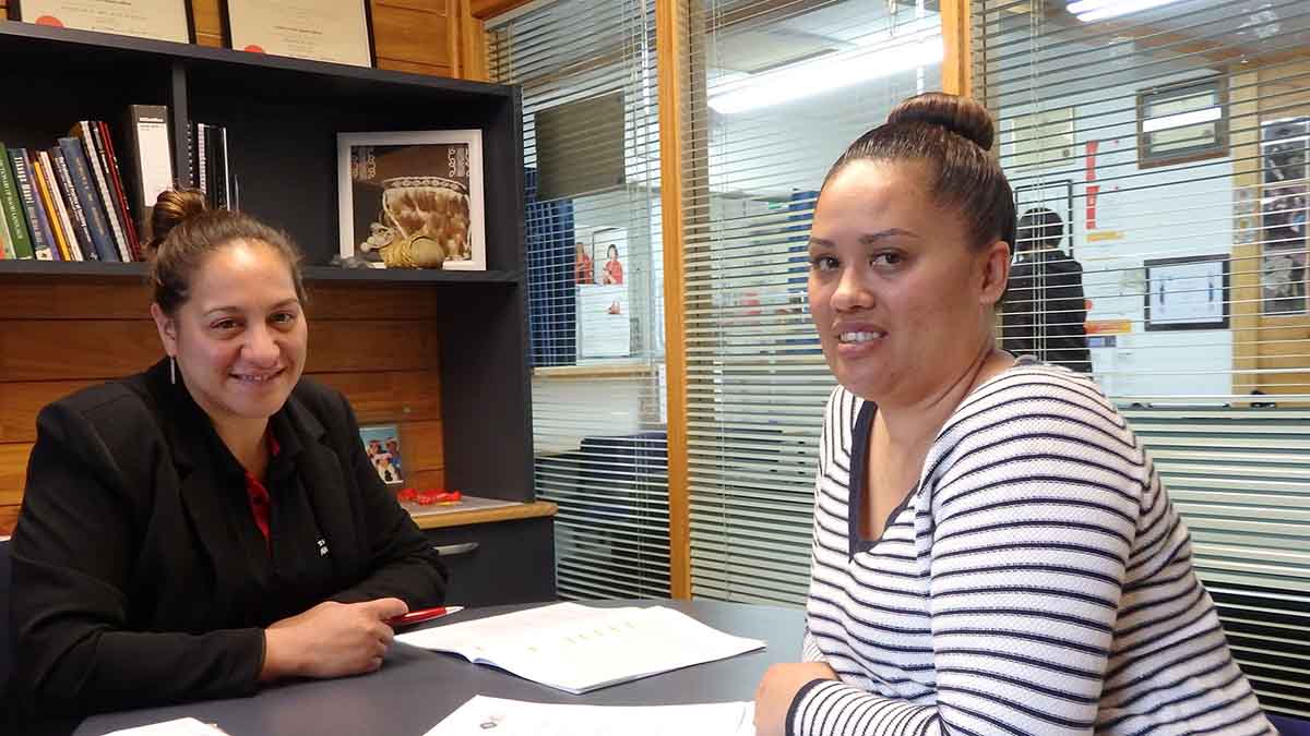 Staff member at Awhi Tauira supporting a student of Awanuiārangi