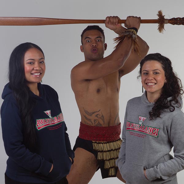 bmpa students posing for photo with maori warrior
